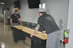 More recently, the trailer dealer and repair shop added a shuffleboard table, arcade game, and dartboard.
