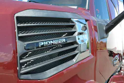 Closeup detail of the chrome Pioneer nameplate integrated into the distinctive new hood intake design, flanked by aerodynamic airflow management channels. Closeup detail of the chrome Pioneer nameplate integrated into the distinctive new hood intake design, flanked by aerodynamic airflow management channels.