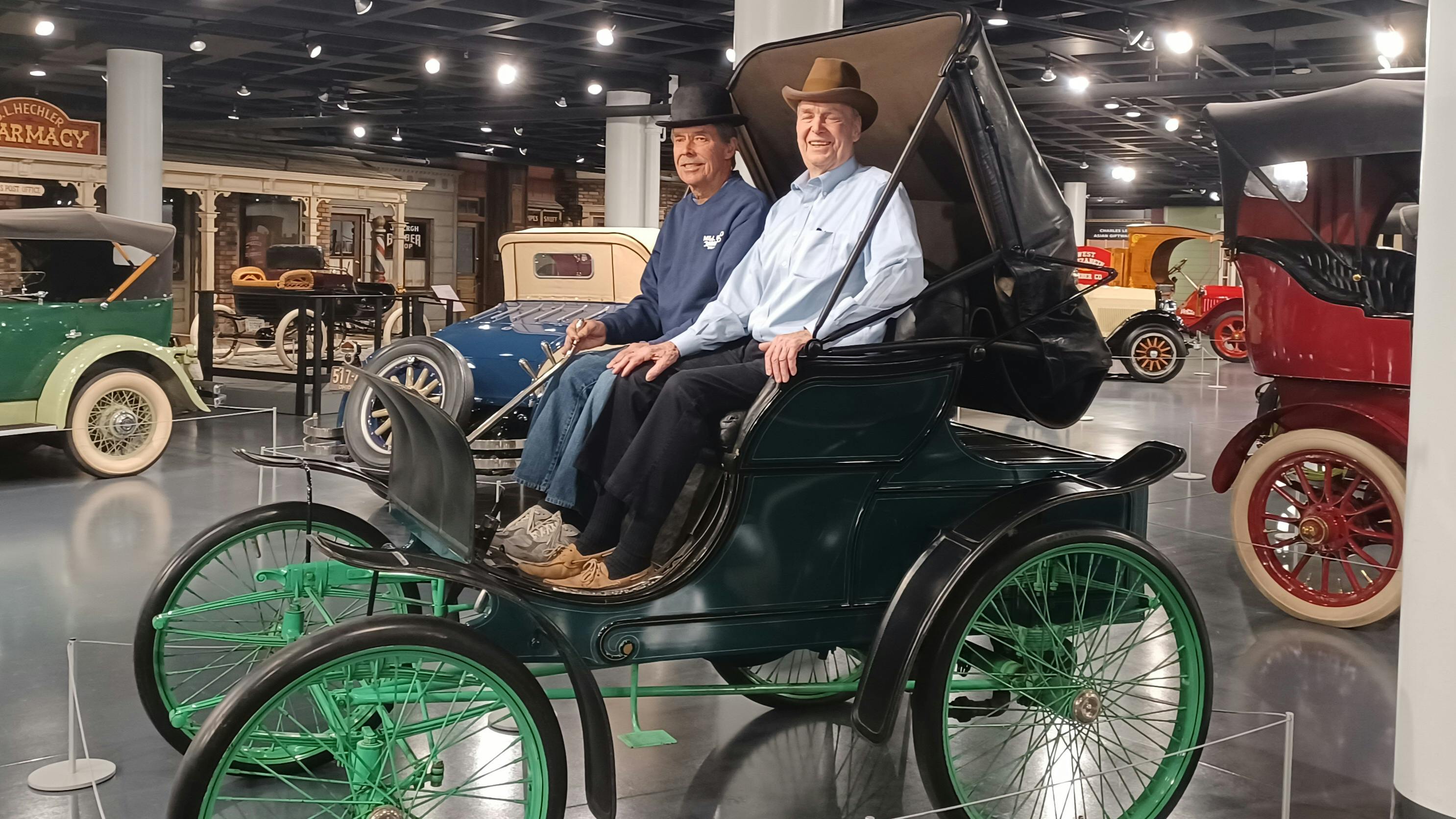 Tony Allison (L) and Jim Winton (R), the great-grandsons of the men involved in the historic first Winton transaction, sit in a Winton Phaeton.