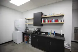 AAA Truck & Trailer Services' driver lounge includes a washer and dryer, shower, kitchenette, office area, and quiet places to relax. The site also includes a dog park.