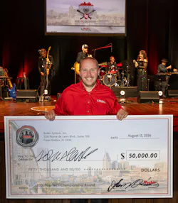 Jean-Sébastien Houle, the 2026 Ryder Top Tech, poses with his $50,000 grand prize check.