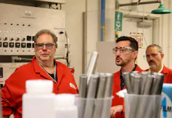 Matt Urbanak, technology manager for the Rotella product line in North America, at left, and Patrick Joyce, a Shell project leader and formulator, listen to a presentation inside the STCH testing lab. Together, the two experts help guide the dual-development strategy for the brand’s commercial lubricants, carefully balancing additive chemistry to meet strict new industry limits while maintaining robust wear protection.