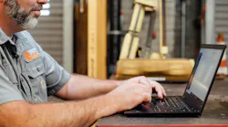 fleetio_customer_with_laptop