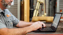 6adfb0aed0e3fc24a8e51ab9 Fleetio Customer With Laptop